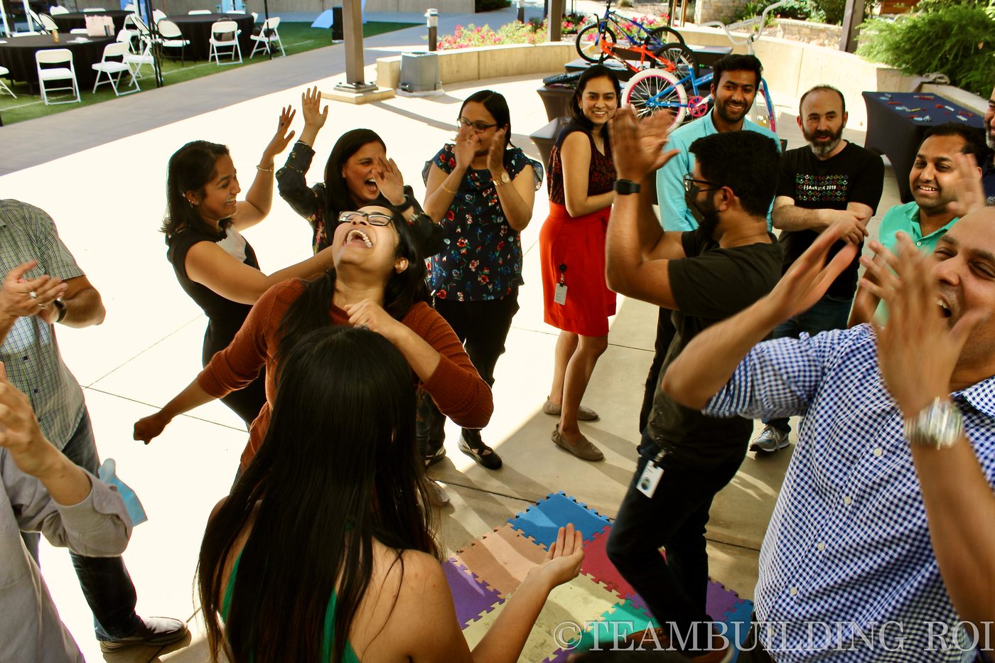 Participants share an energetic team moment during the event.